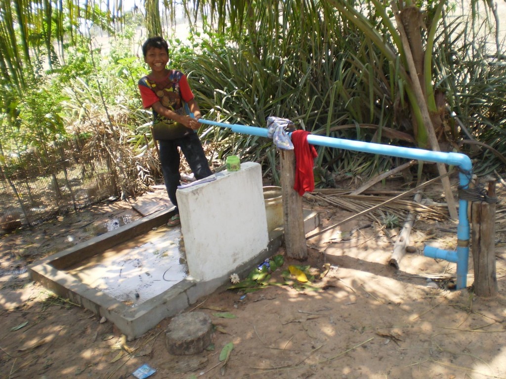 Young boy is pulling the pump