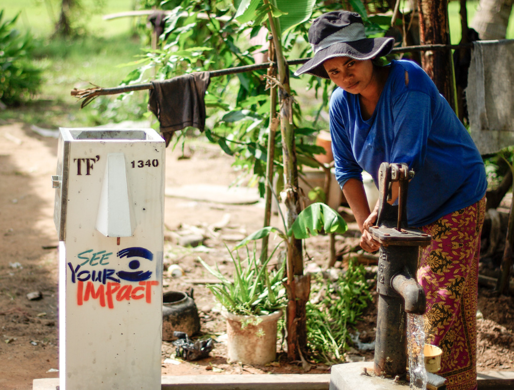 A lady prepares her new biosand water filter